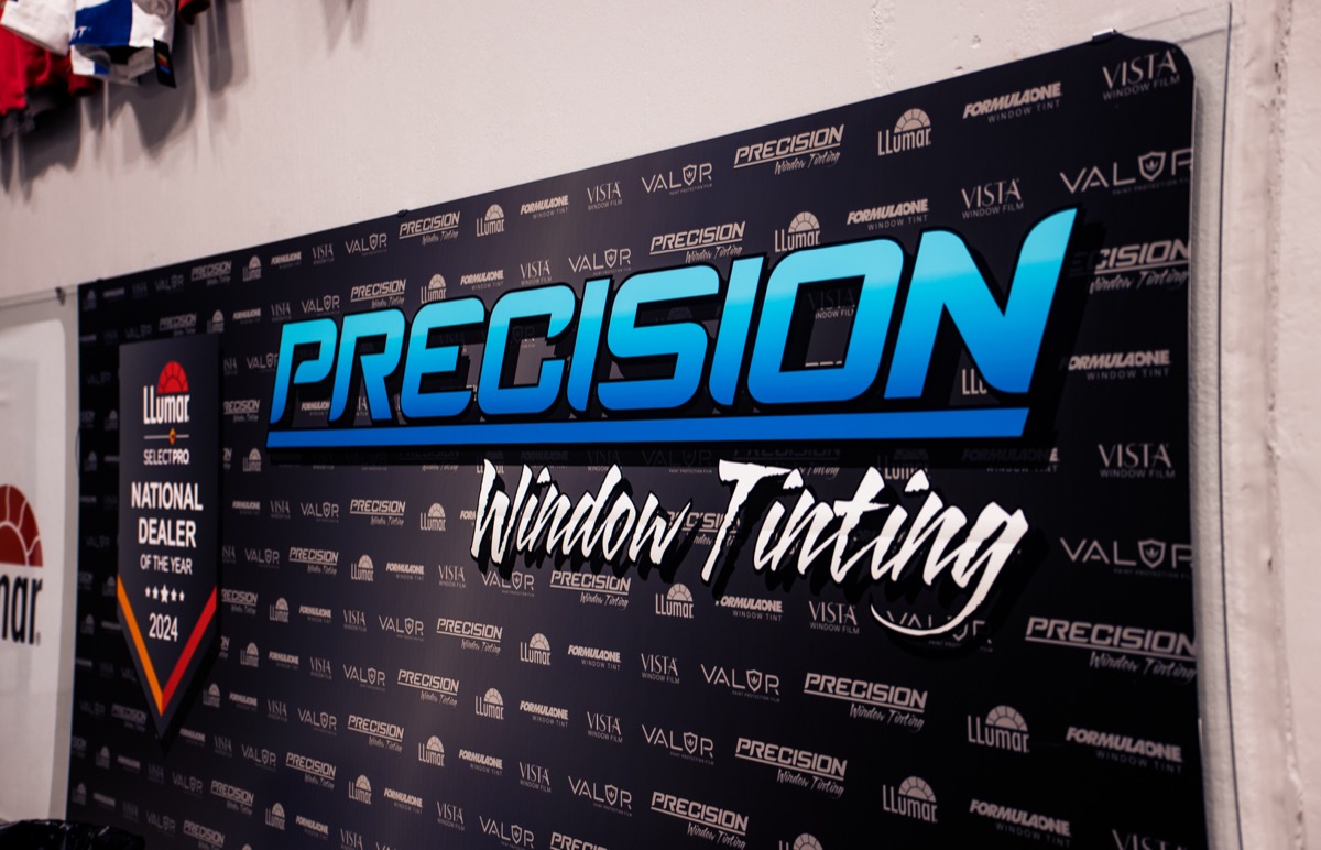Precision National Dealer of the Year window tint award sign hangin in estate location