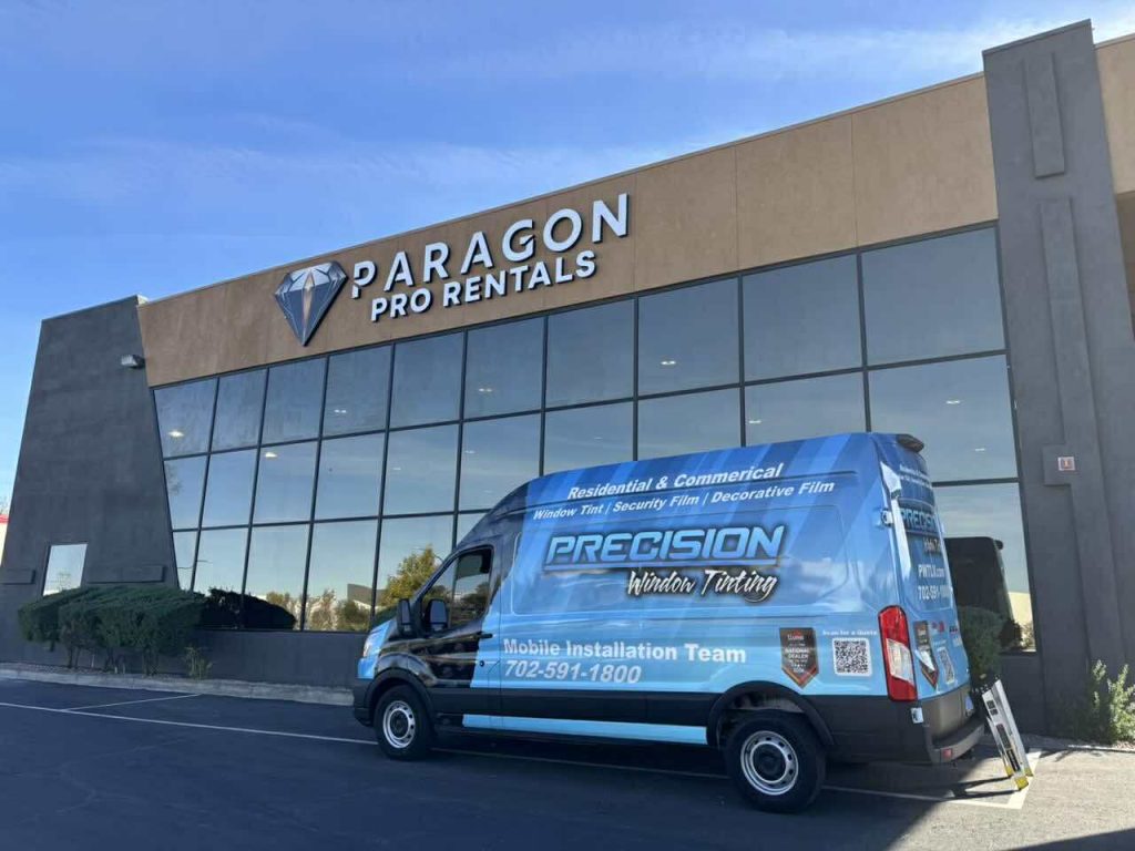 Image of precision window tint installation van parked out front of a commercial tint jobsite